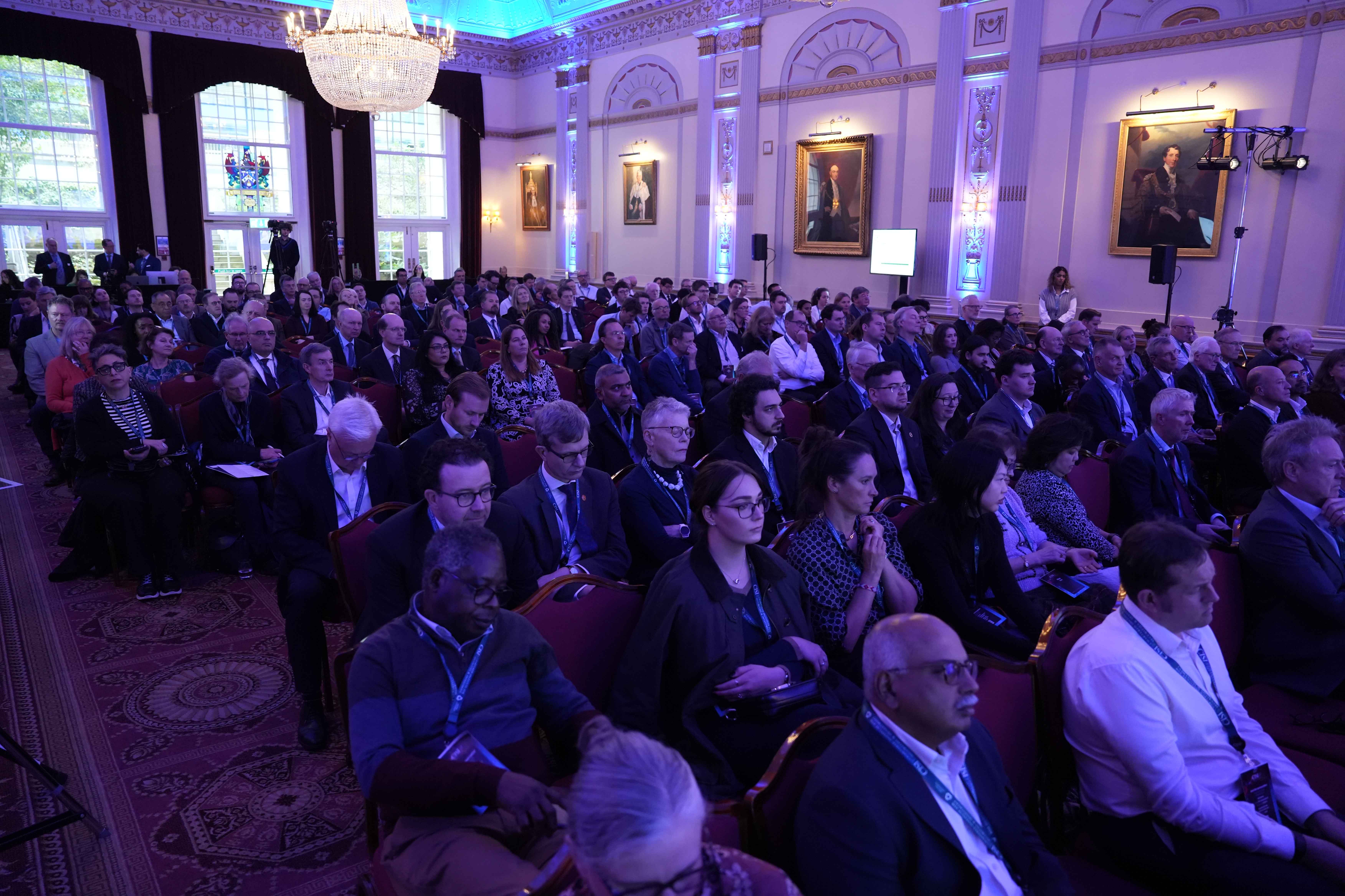 Panellists debating ethical dilemmas on stage at the Annual Integrity Event