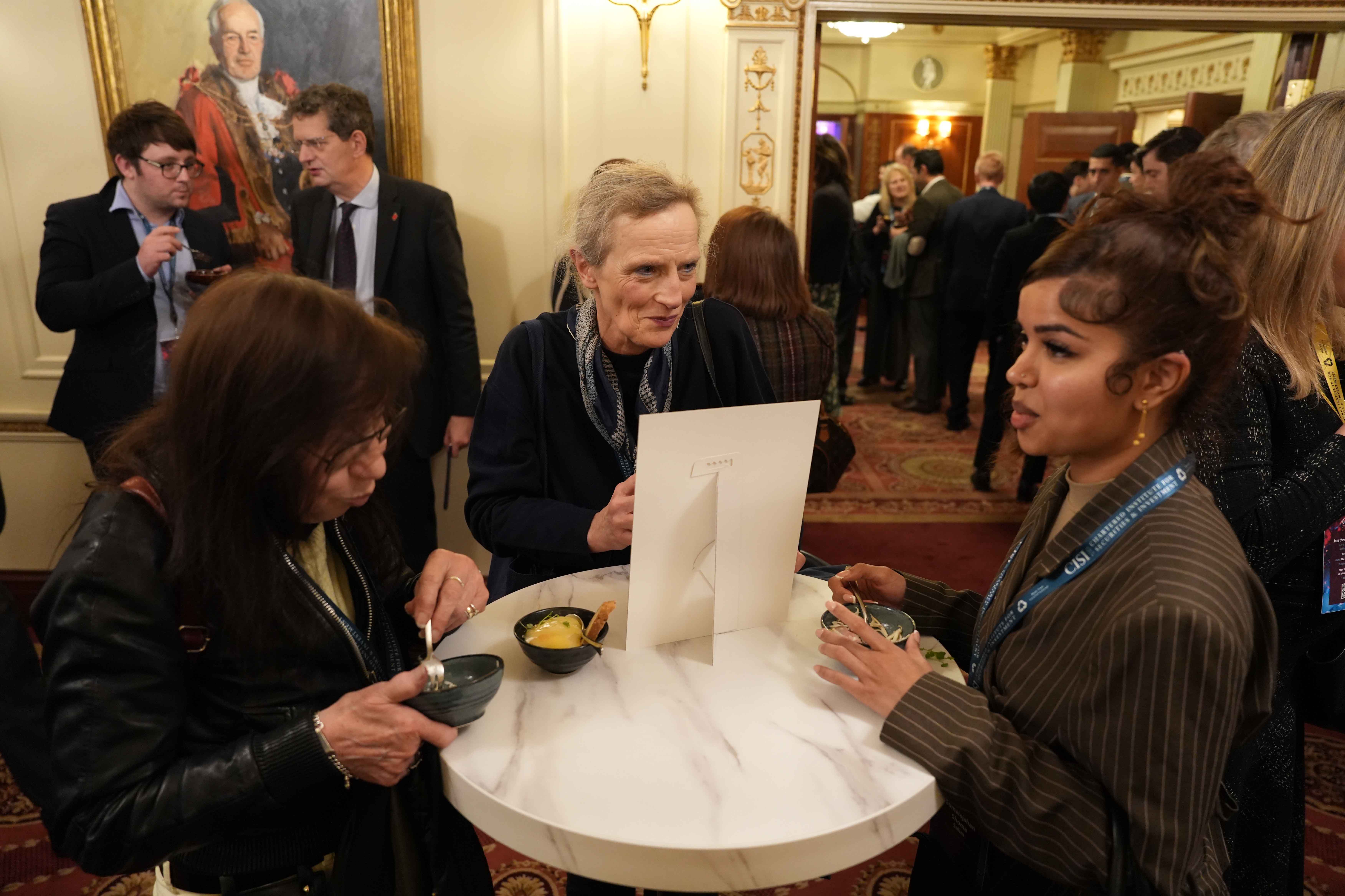 Delegates conversing and networking during the event reception